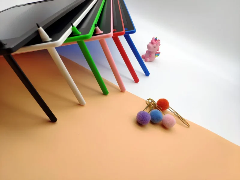 Colorful tablets and stationery on a desk